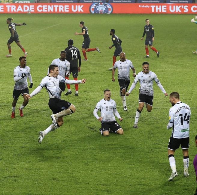 The Swans celebrate an equaliser at the Liberty Stadium
